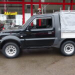 Suzuki Jimny mit HILLTIP SnowStriker VP und LEHNER Heckanbaustreuer